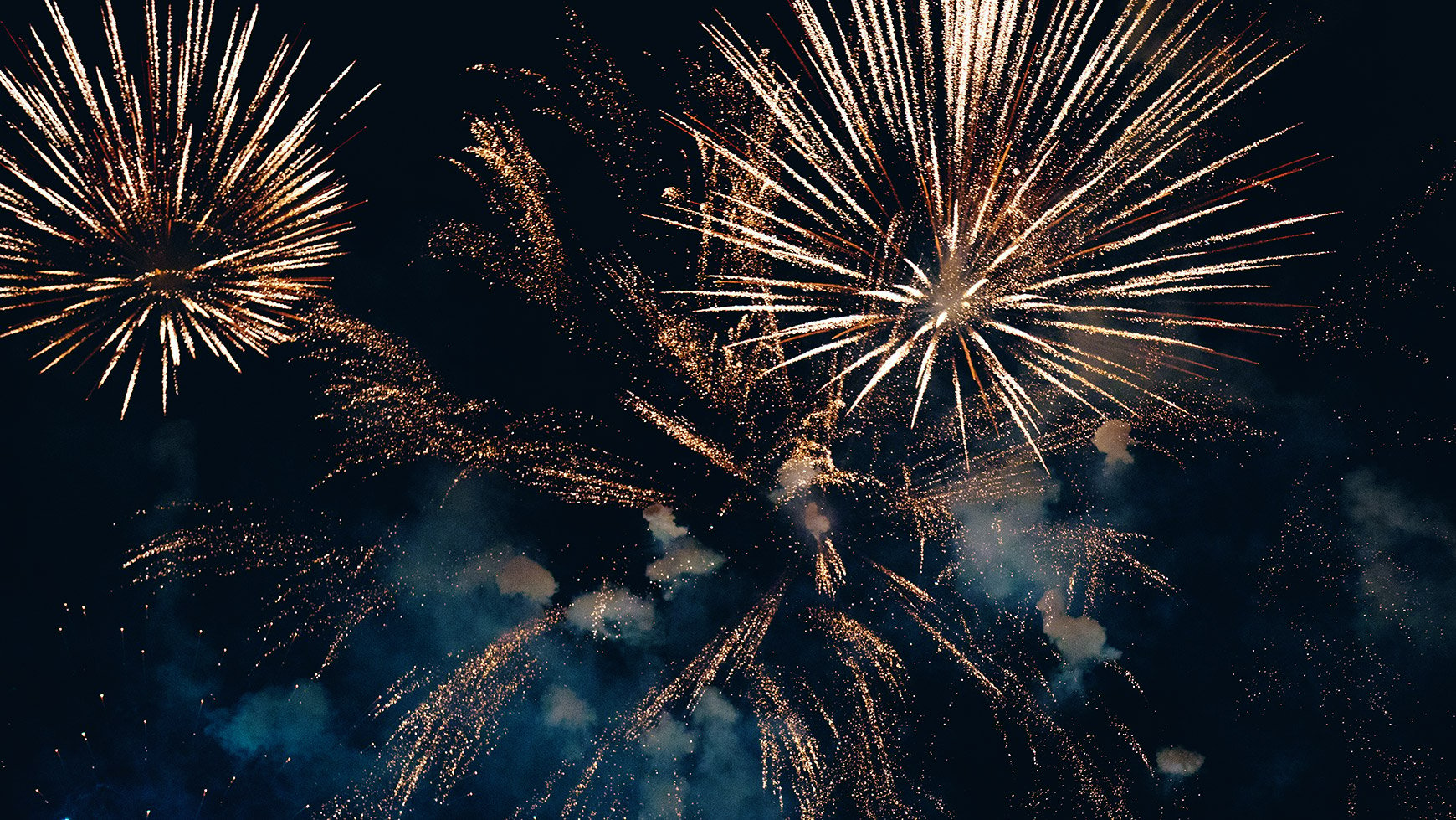 Colourful fireworks against a very dark sky