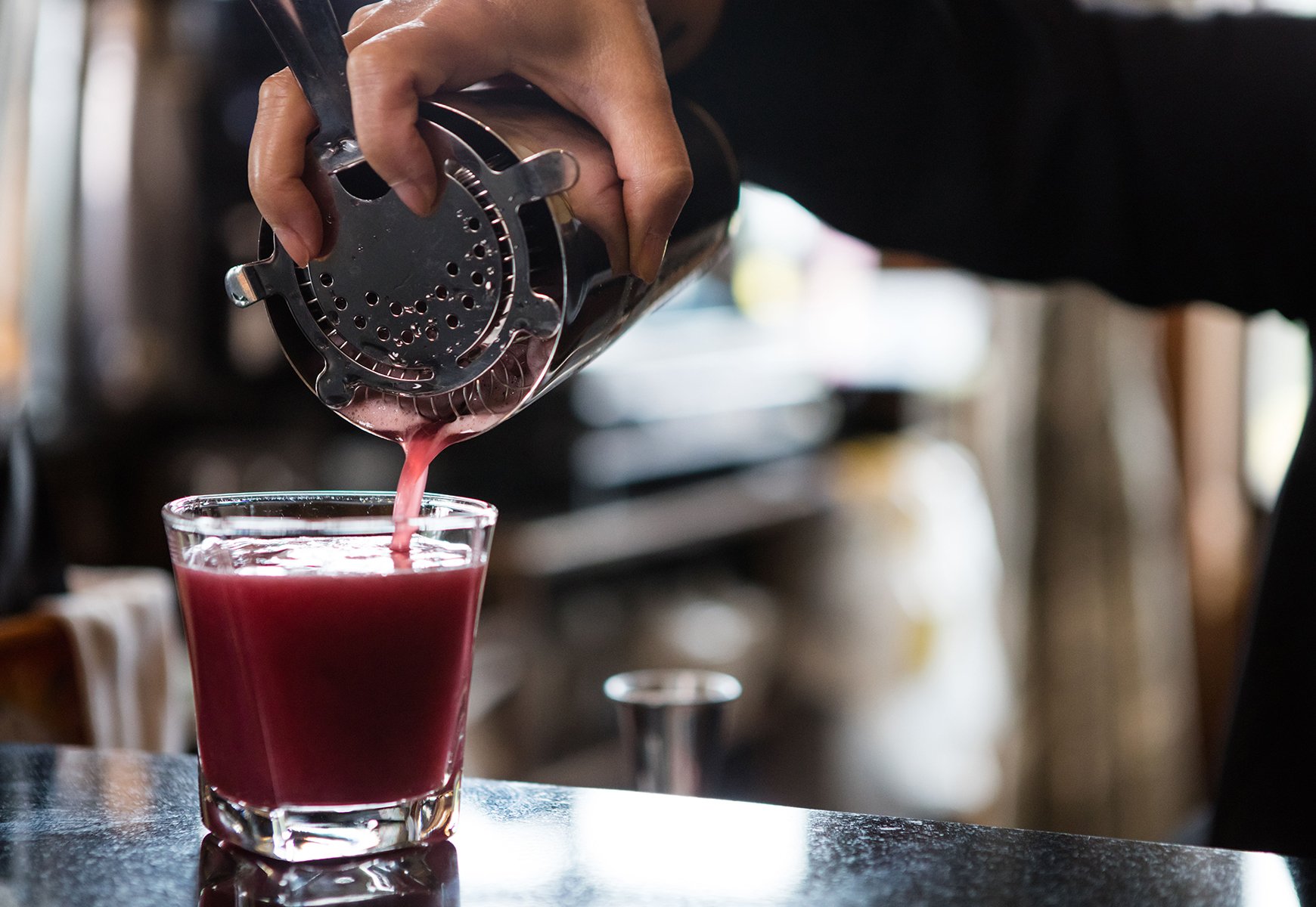 Close up of a cocktail being poured